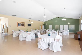 A banquet hall with tables set up for an event.